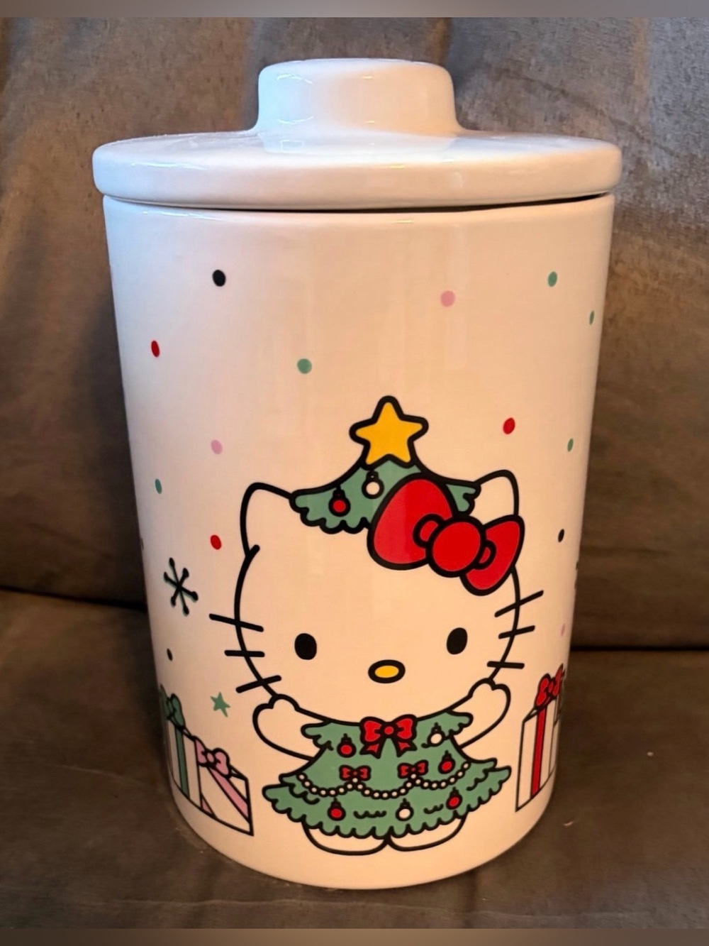 New! 7.25 tall, 5.5” wide 
Ceramic cookie jar 
Hello Kitty on the front & back